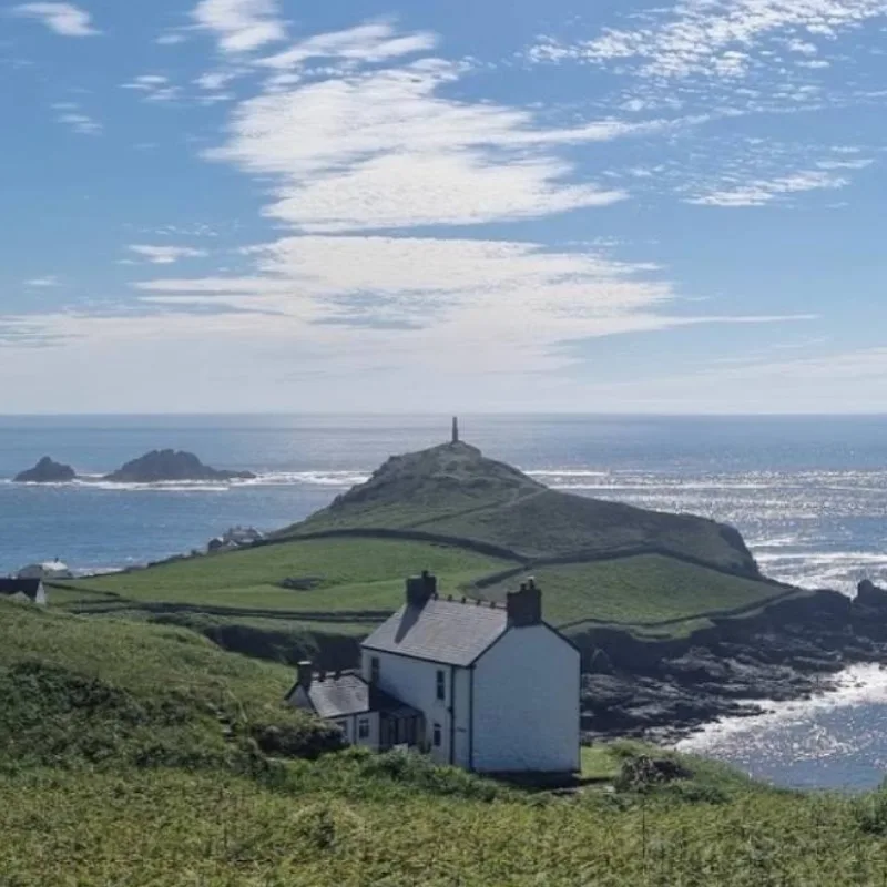 Wheal Call holiday cottage retreat basking in the sunshine with Cape Cornwall and The Brisons in the background
